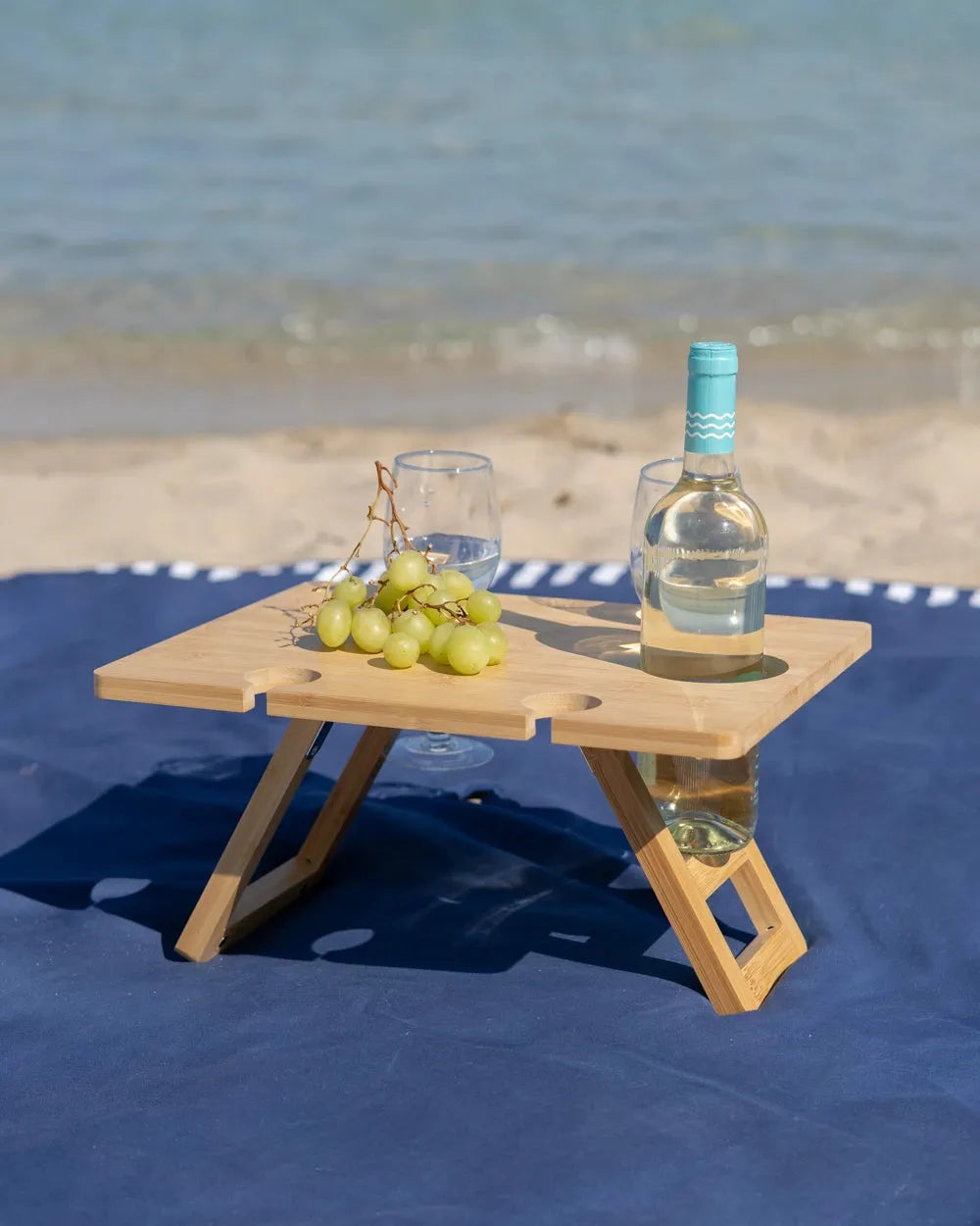 Mesa de playa portátil baja con patas