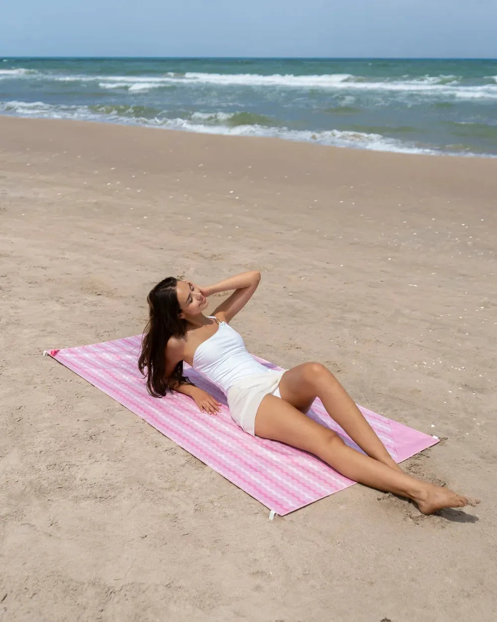 Toalla de playa color rosa