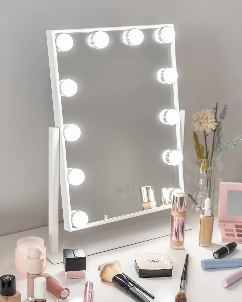 An illuminated tabletop beauty mirror with adjustable lighting