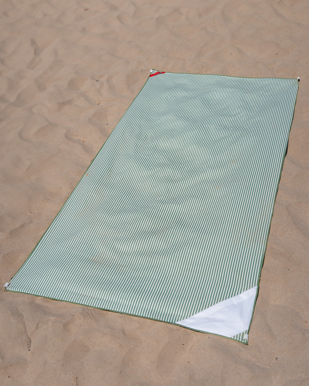 toalla de playa verde